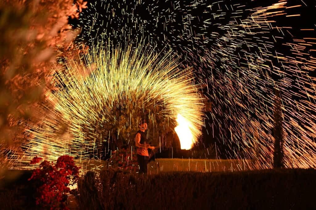 Fireworks lighting the night sky above a celebration