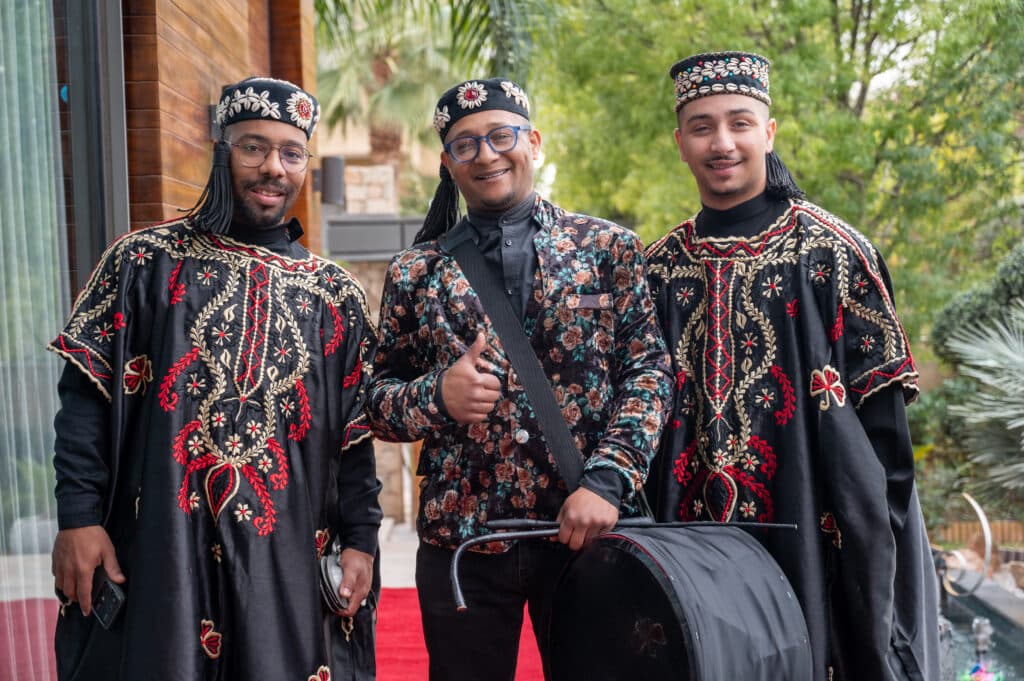 Traditional musicians in embroidered ceremonial clothing