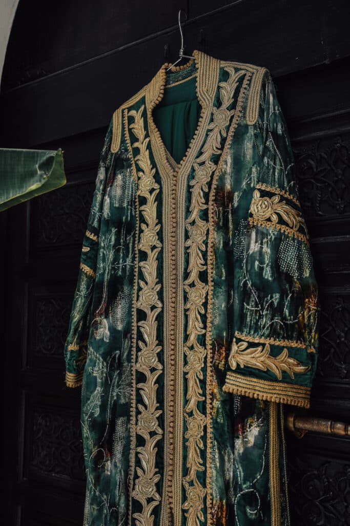 A richly embroidered traditional garment prepared for a celebration